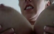 MILF squeezing titties 