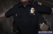 Black stud fucks two horny milf cops